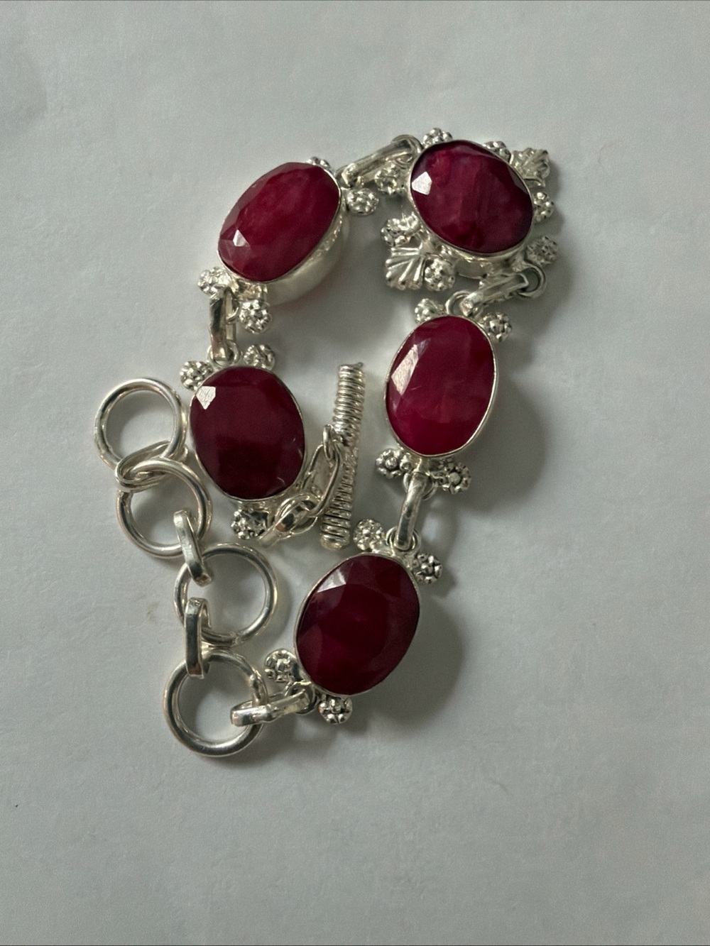 Sterling Silver Bracelet with Faceted Ruby-Red Stones